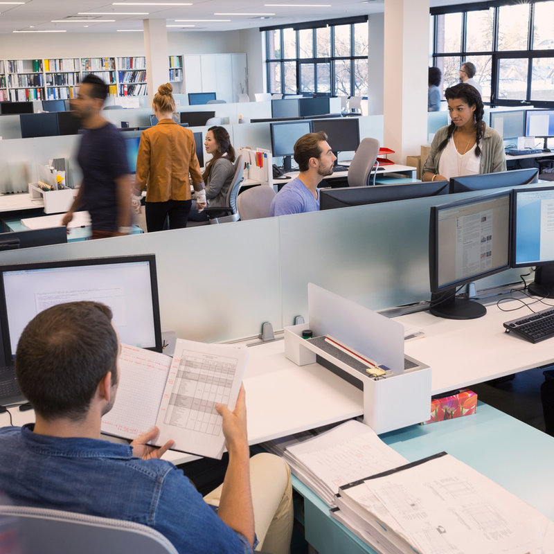 Colleagues collaborating in a modern workplace